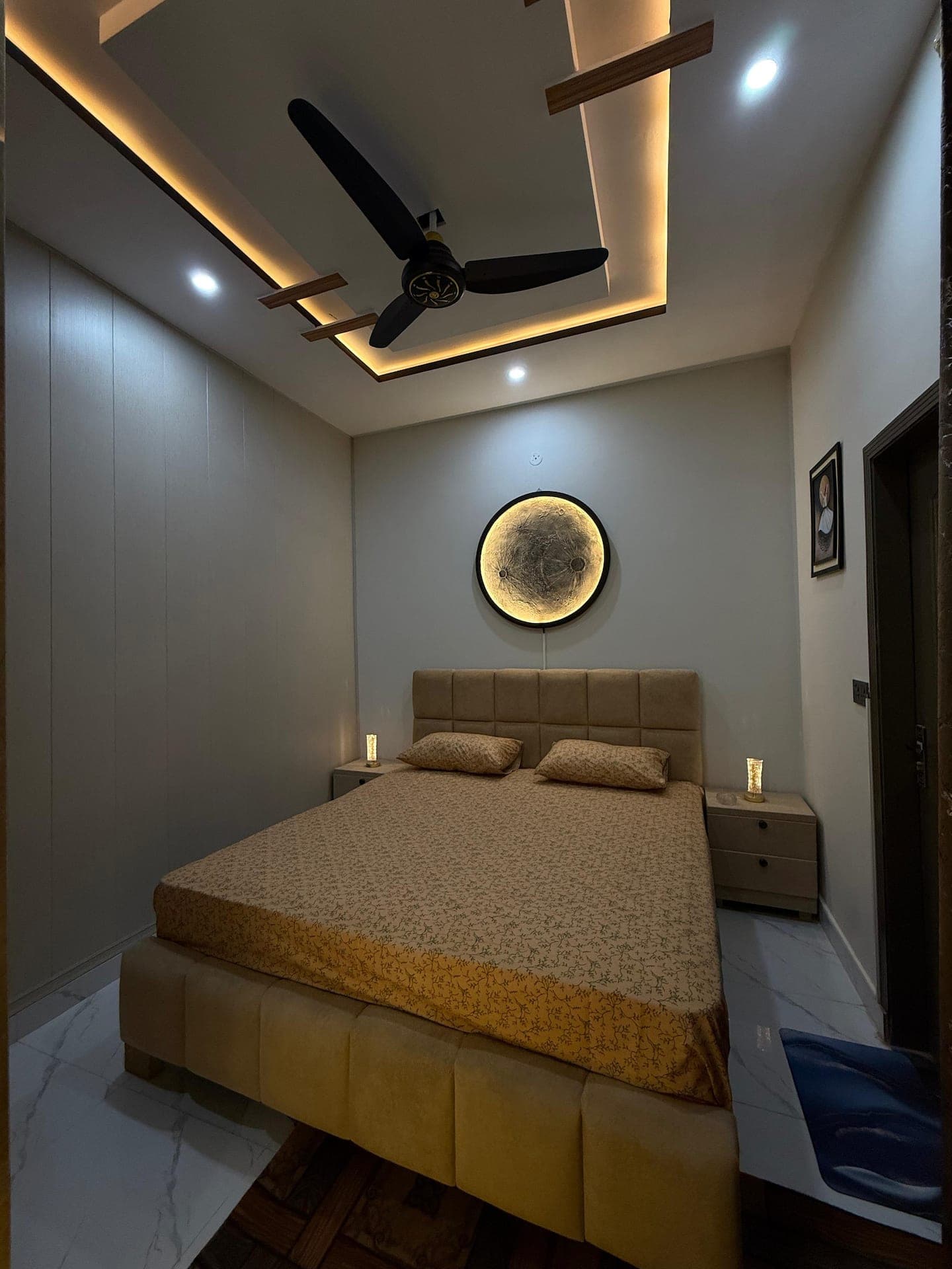Modern bedroom of a 1-bedroom home in Lahore with kitchen and free parking